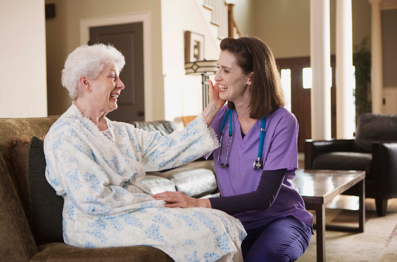 a home healthcare nurse with a female elderly patient